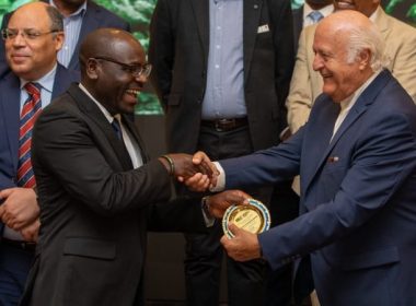 Investment, Industry and Trade deputy Minister Exaud Kigahe (left) receives an appreciation award from Mkinga Economic Zone project chairman Nauel All Assad
