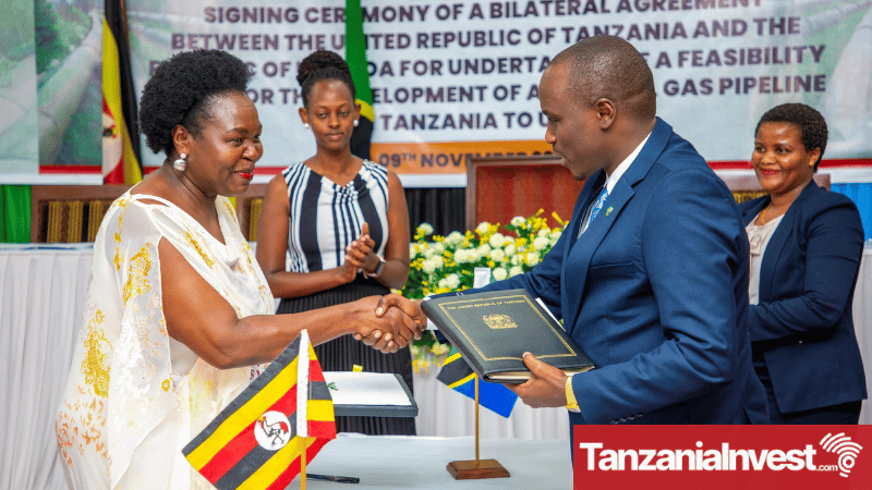 Tanzania's Energy Minister Doto Biteko and Uganda's Energy Minister Ruth Nankabirwa signing the gas pipeline feasibility study agreement